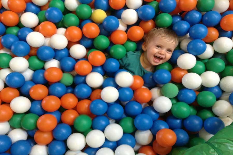 Smiling Child in Ball Pool